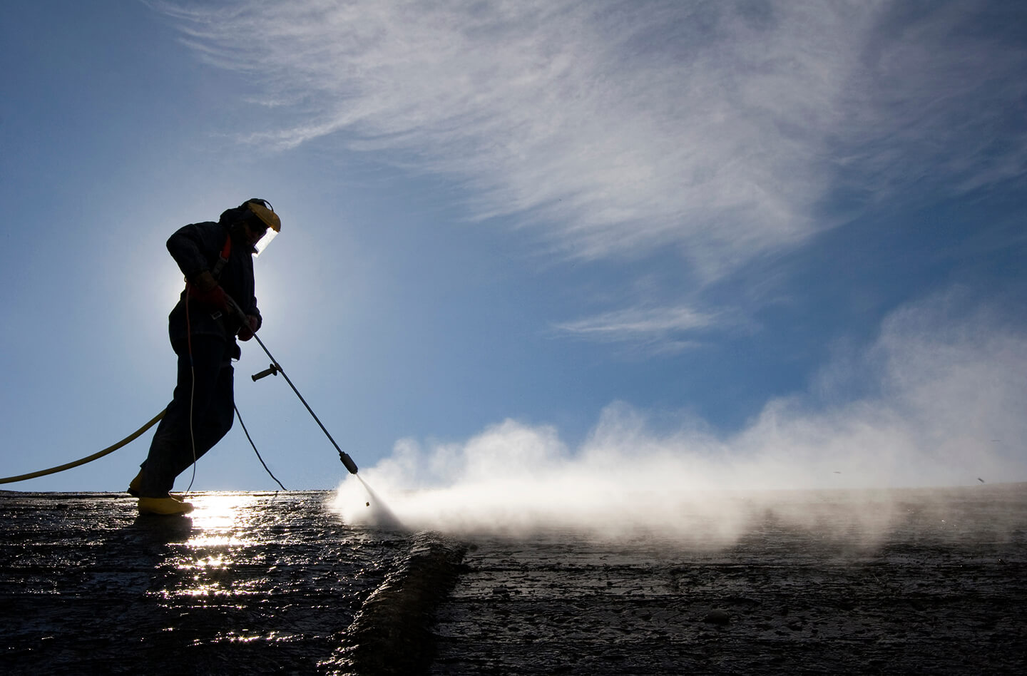 A worker performing industrial cleaning